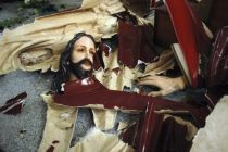 A statue of Jesus Christ is left smashed on the floor at the church ...