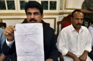 In this file photo, Shahbaz Bhatti, left, shows press a threatening ...