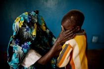 This file photo shows a mass rape victim and her son in the town of ...
