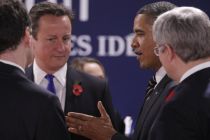 US President Barack Obama talks with British Prime Minister David ...