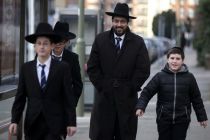 a-jewish-man-walks-with-young-jewish-boys-in-golders-green-london-january-10-2015