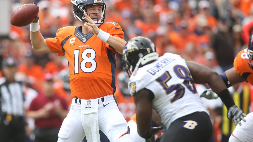 Denver Broncos quarterback Peyton Manning (18) unhappily leaves