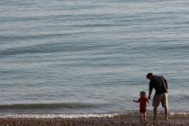 man-and-child-along-english-beach