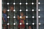 women-and-children-that-fled-manbij-city-stand-inside-a-building-behind-a-barred-window-in-aleppo-yesterday-after-arriving-in-the-areas-that-syria-democratic-forces-alliance-forces-took-control-of