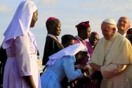 a-nun-kisses-the-hand-of-pope-francis-at-the-start-of-his-visit-to-uganda-last-year