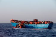 a-rescue-boat-of-the-spanish-ngo-proactiva-approaches-an-overcrowded-wooden-vessel-with-migrants-from-eritrea-off-the-libyan-coast-in-the-mediterranean-last-month
