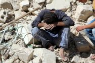 a-man-mourns-relatives-killed-yesterday-in-the-latest-airstrike-on-the-rebel-held-al-qaterji-neighbourhood-of-aleppo-in-syria