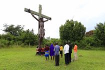 school-girls-pray-in-front-of-a-crucifix-at-their-school-in-kakoge-north-of-ugandas-capital-kampala-in-october-last-year
