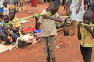 martin-andrea-10-and-a-friend-play-with-toy-guns-made-fromreeds-at-a-displaced-persons-camp-protected-by-un-peacekeepers-in-wau-south-sudan