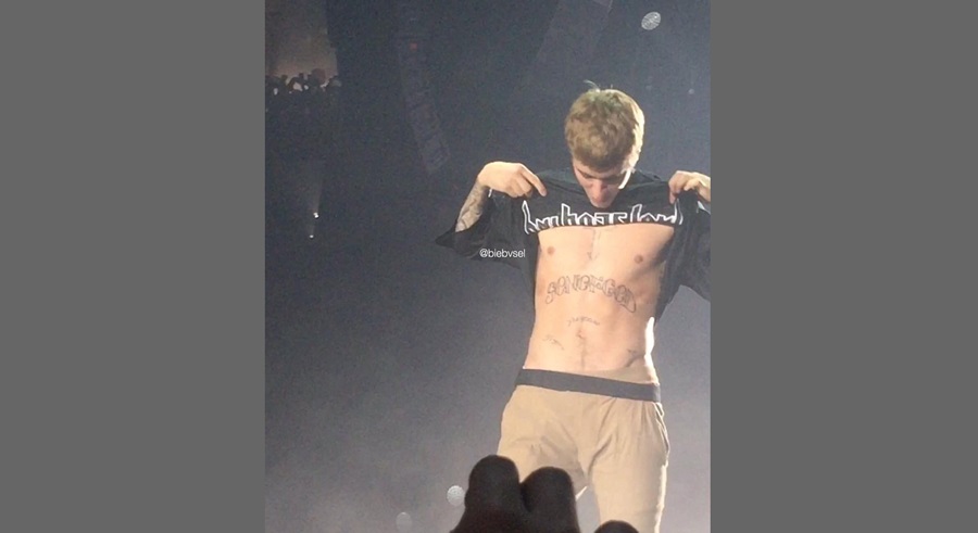 Justin Bieber Bares New Son of God Tattoo on His Abs His 56th Body  Artwork During Italy Concert