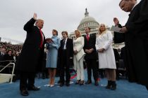 president-donald-trump-takes-the-oath-of-office-as-his-wife-melania-holds-two-bibles-lincolns-bible-and-his-family-bible-while-his-children-barron-ivanka-eric-and-tiffany-watch-and-supreme-court-chief-justice-john-roberts-administers-the-oath