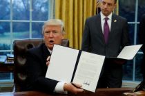 on-his-first-full-day-in-office-donald-trump-signs-executive-orders-in-the-oval-office