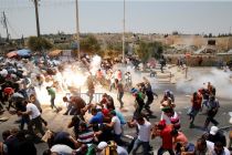 palestinians-react-following-tear-gas-that-was-shot-by-israeli-forces-after-friday-prayer-on-a-street-outside-jerusalems-old-city