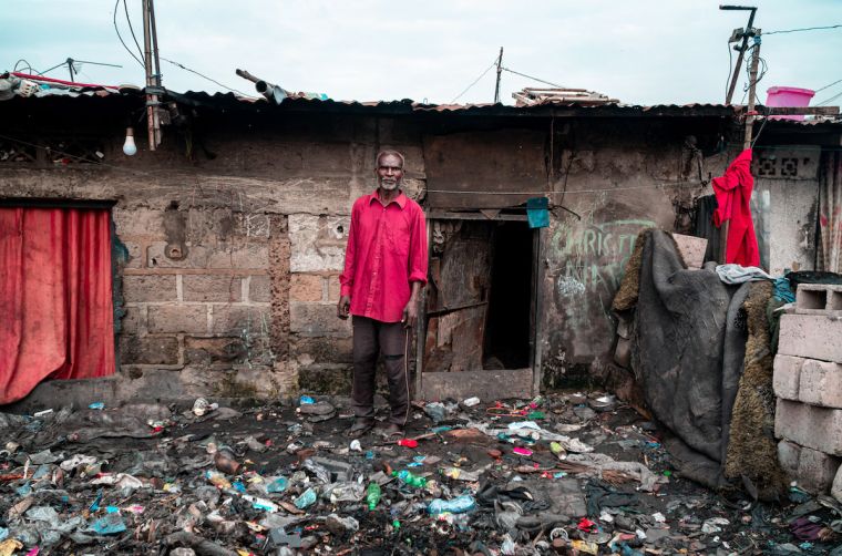 The River Congo is flooding because of plastic waste, affecting the homes of Jean (pictured) and his neighbours.