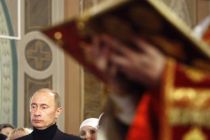 Russia's President Vladimir Putin attends a Christmas Eve service at ...