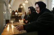 Iranian Christian women light candles, during Christmas mass at a ...