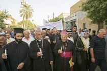 Christian march through Baghdad in protest against the removal of a ...