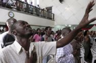 Kenyan join in prayers at International Christian Church in Nairobi, ...