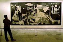 A person views Spanish artist Pablo Picasso's world famous painting ...